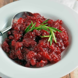 This homemade Cranberry Relish recipe is perfect for your Turkey Day festivities and will soon be a must-have every holiday season.  #cranberryrelish #cranberrysauce www.savoryexperiments.com
