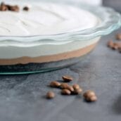 Mocha Cream Pie Recipe is three layers of delicious pie: brownie base, chocolate pudding, and whipped cream top all laced with coffee. #mochacreampie #brownies #creampie www.savoryexperiments.com