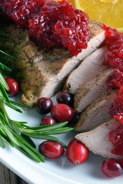 pork tenderloin sliced with cranberry sauce