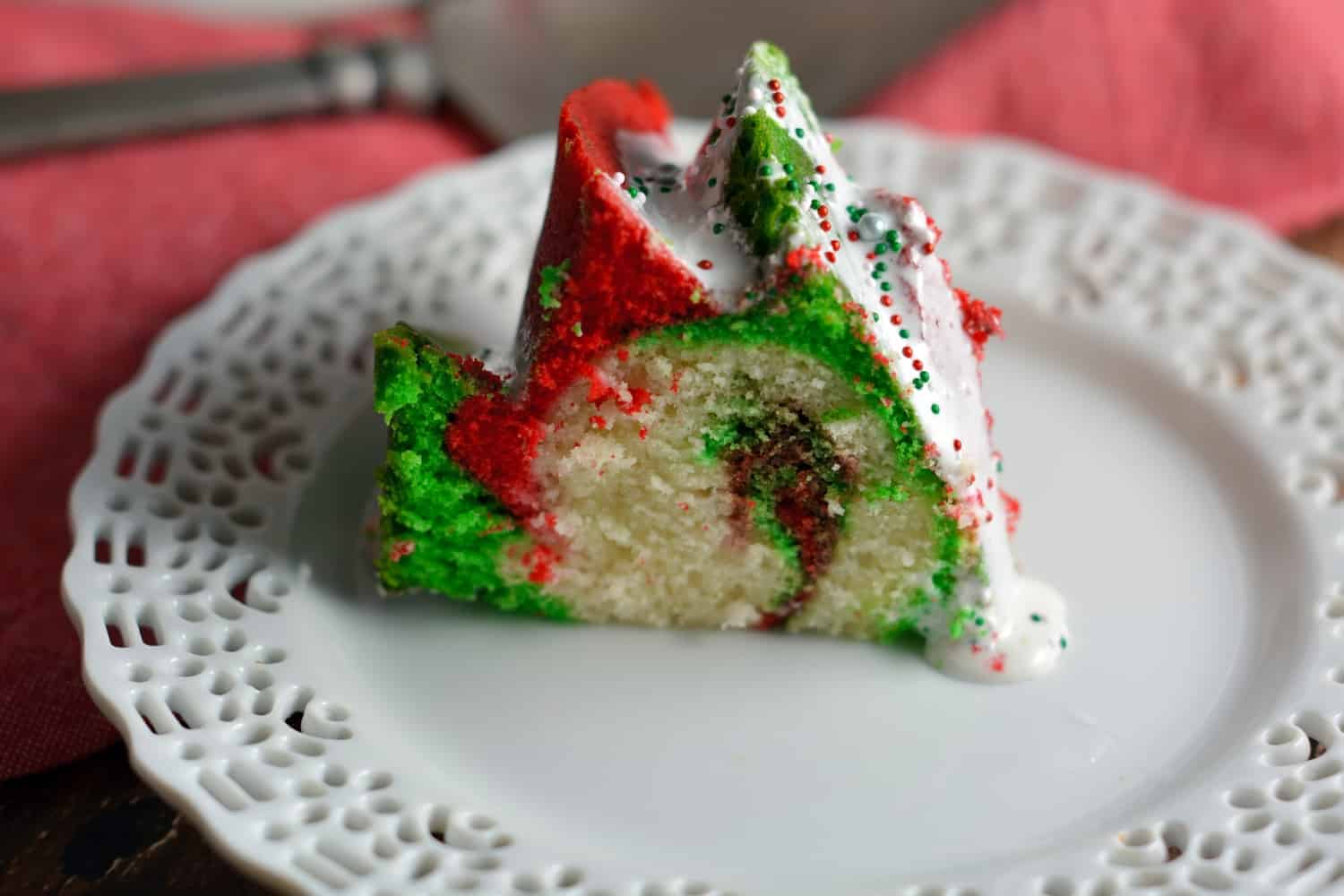 Christmas Swirl Bundt Cake Recipe- You won't believe how easy it is to create this beautiful and festive vanilla flavored Christmas Swirl Bundt Cake!