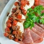 Warm Tomato and Shallot Mozzarella Cheese Recipe- Grape tomatoes and shallots simmered in a sweet balsamic sauce over soft mozzarella cheese. It only takes 6 ingredients and 20 minutes!