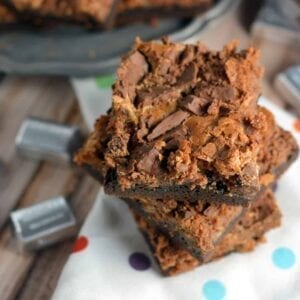 Triple Chocolate Cookies Cheesecake Bars Recipe- Soft and Chewy with a fudge cake mix cookie crust and chocolate cheesecake topped with milk chocolate crumbles. A chocolate lover's dream come true!