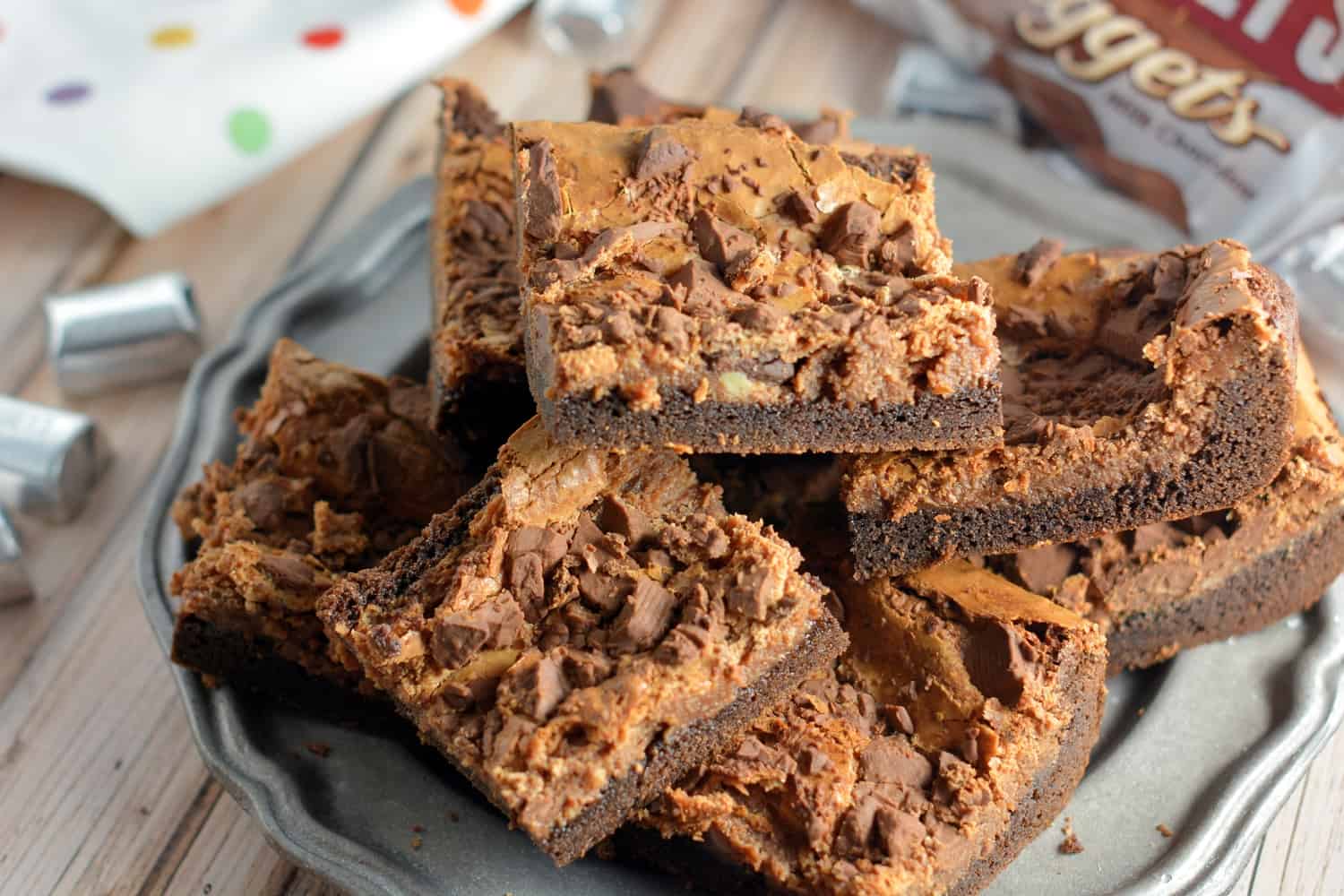 Triple Chocolate Cookies Cheesecake Bars Recipe- Soft and Chewy with a fudge cake mix cookie crust and chocolate cheesecake topped with milk chocolate crumbles. A chocolate lover's dream come true!