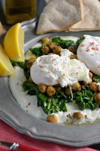 Za’atar Chickpeas and Poached Eggs is a refreshing, health and gluten-free breakfast option. Lemon zested yogurt sauce, za’atar spiced chickpeas, wilted spinach and poached eggs sprinkled with pink sea salt.