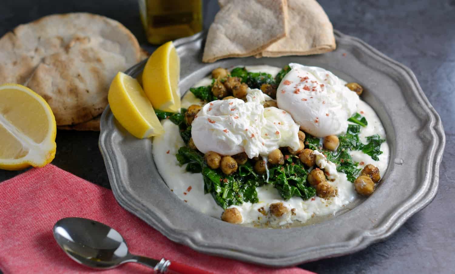 Za’atar Chickpeas and Poached Eggs is a refreshing, health and gluten-free breakfast option. Lemon zested yogurt sauce, za’atar spiced chickpeas, wilted spinach and poached eggs sprinkled with pink sea salt.