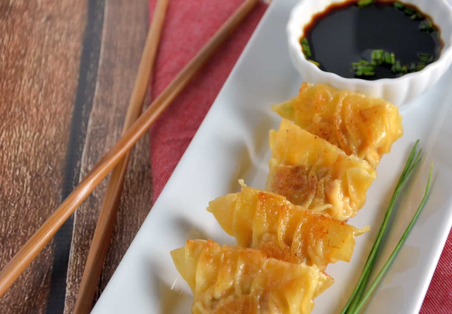 Authentic Homemade Dumplings (Potstickers) recipe! Learn how to make pork and shrimp dumplings using a real Chinese restaurant recipe! Plus a tutorial on how to fold a dumpling and dumplings dipping sauce.