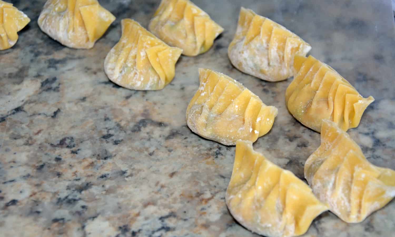 Authentic Homemade Dumplings (Potstickers) recipe! Learn how to make pork and shrimp dumplings using a real Chinese restaurant recipe! Plus a tutorial on how to fold a dumpling and dumplings dipping sauce.