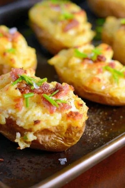 These cheesy twice baked potatoes are the BEST! My whole family gobbles them up, so I make double. The secret ingredient really makes these POP and stand out from the rest.