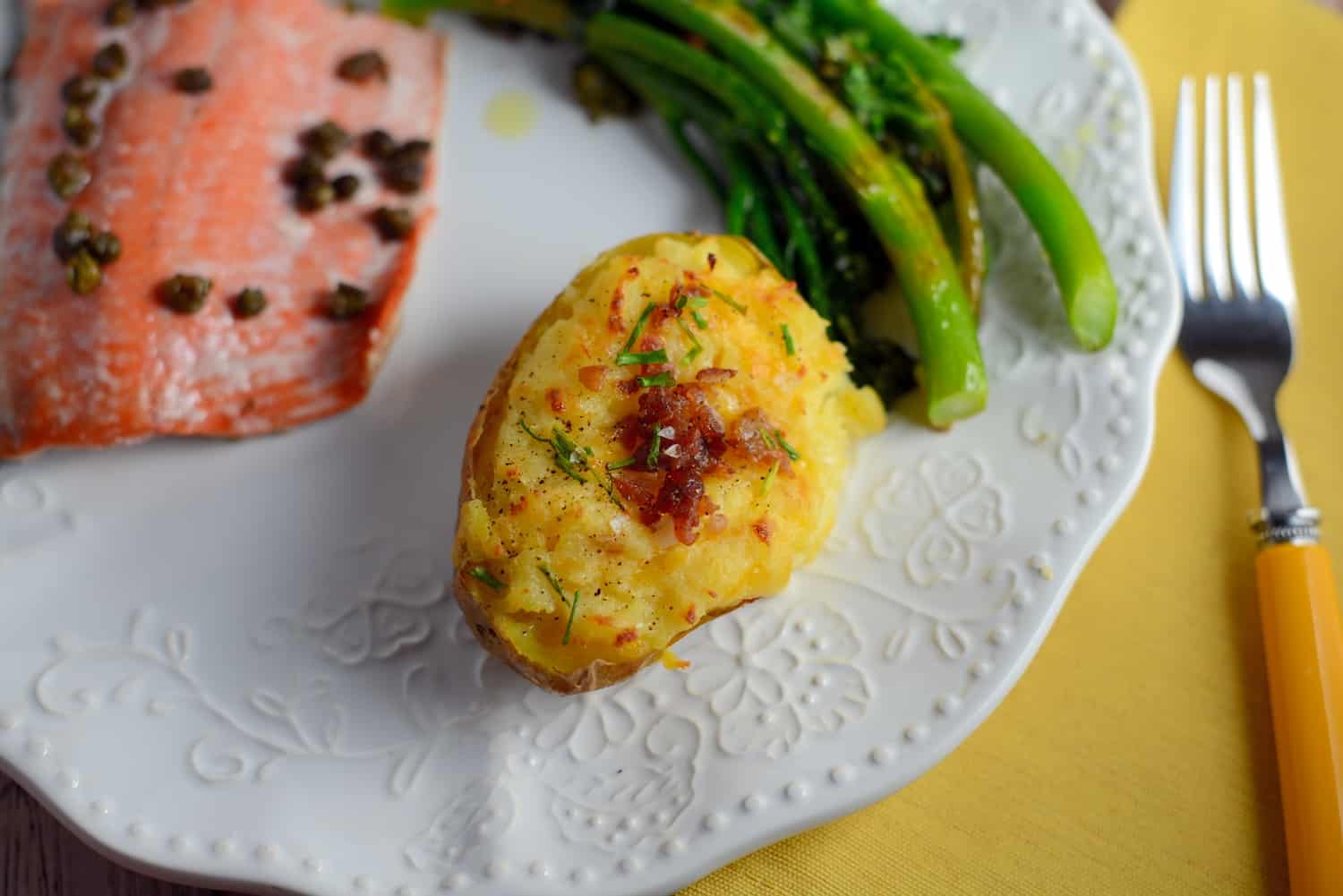 These cheesy twice baked potatoes are the BEST! My whole family gobbles them up, so I make double. The secret ingredient really makes these POP and stand out from the rest.