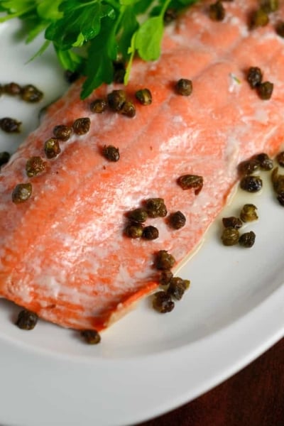 Crispy Caper Lemon Salmon is one of the best healthy salmon recipes. This lemon salmon is quick, easy and healthy! Crispy capers add texture sophistication to this easy weeknight meal.