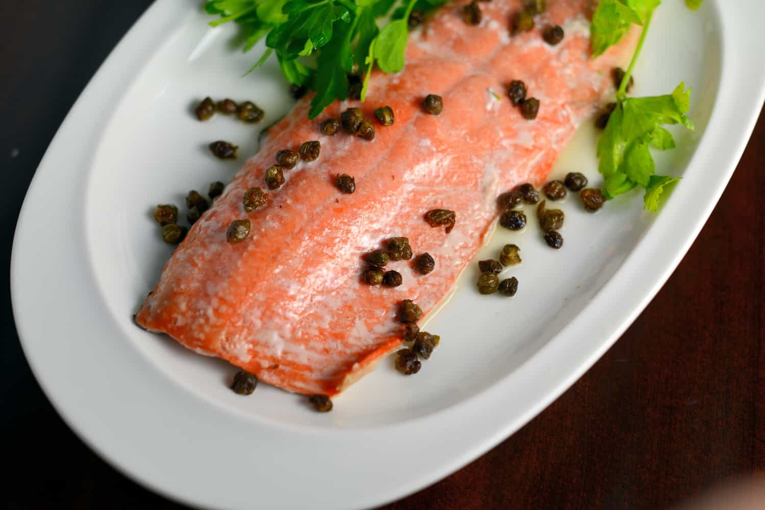 Crispy Caper Lemon Salmon is one of the best healthy salmon recipes. This lemon salmon is quick, easy and healthy! Crispy capers add texture sophistication to this easy weeknight meal.