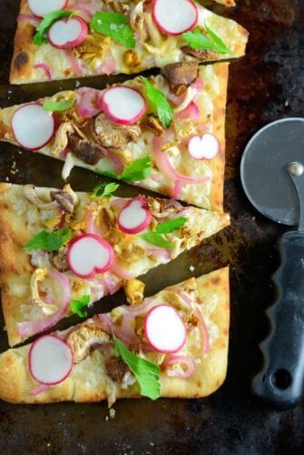 Horseradish and Mushroom Flatbread can be served as an appetizer or entree, perfect for your vegetarian friends, but hearty enough for meat-eaters. A mushroom blend, fresh radishes, pickled red onion, tangy horseradish cheddar cheese, Italian parsley and Maldon sea salt make this one of the best dishes you will ever eat!