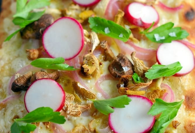 Horseradish and Mushroom Flatbread can be served as an appetizer or entree, perfect for your vegetarian friends, but hearty enough for meat-eaters. A mushroom blend, fresh radishes, pickled red onion, tangy horseradish cheddar cheese, Italian parsley and Maldon sea salt make this one of the best dishes you will ever eat!