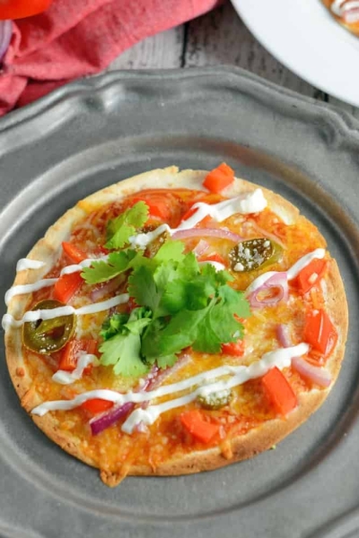 Mexican Pizza is the best meal and snack recipe ever! With just a small handful of ingredients, Mexican Pizza is a perfect party idea. #mexicanpizza #partyfood www.savoryexperiments.com