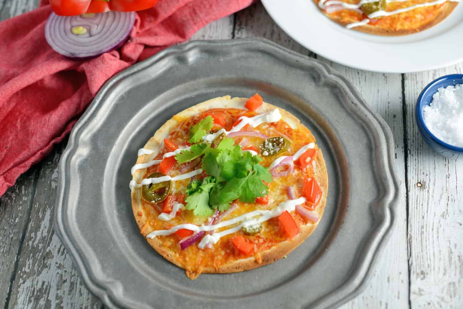 Mexican Pizza is the best meal and snack recipe ever! With just a small handful of ingredients, Mexican Pizza is a perfect party idea. #mexicanpizza #partyfood www.savoryexperiments.com
