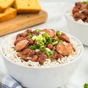 angle view of red beans and rice in a white bowl