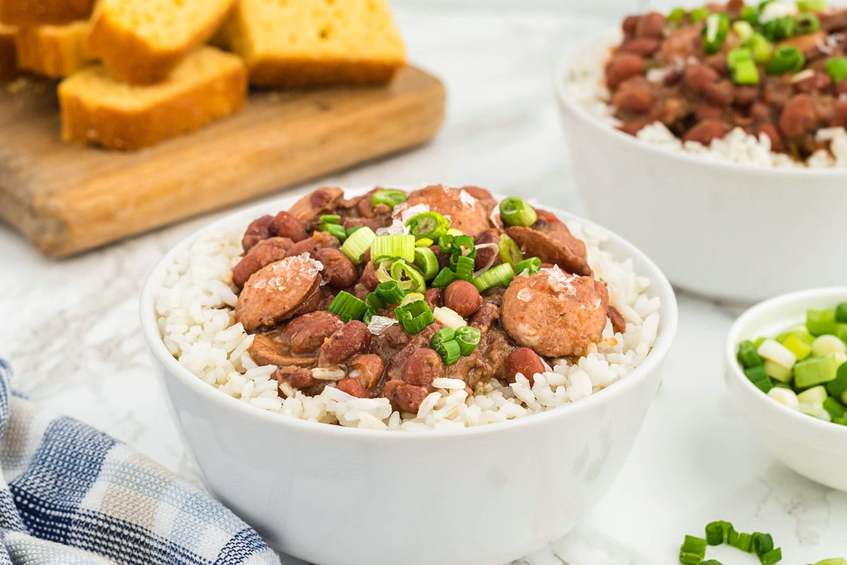 angle view of red beans and rice in a white bowl