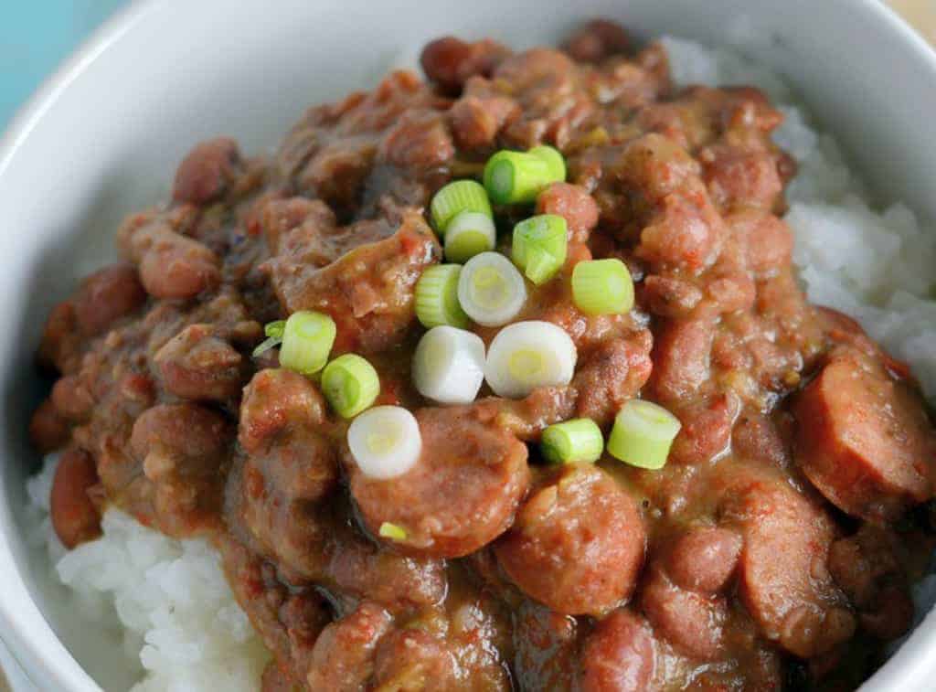 Red Beans and Rice is a classic Carnival and Mardi Gras dish straight from New Orleans. Find the trick for the perfect texture in this recipe! #redbeansandrice #mardigras #creolefood www.savoryexperiments.com