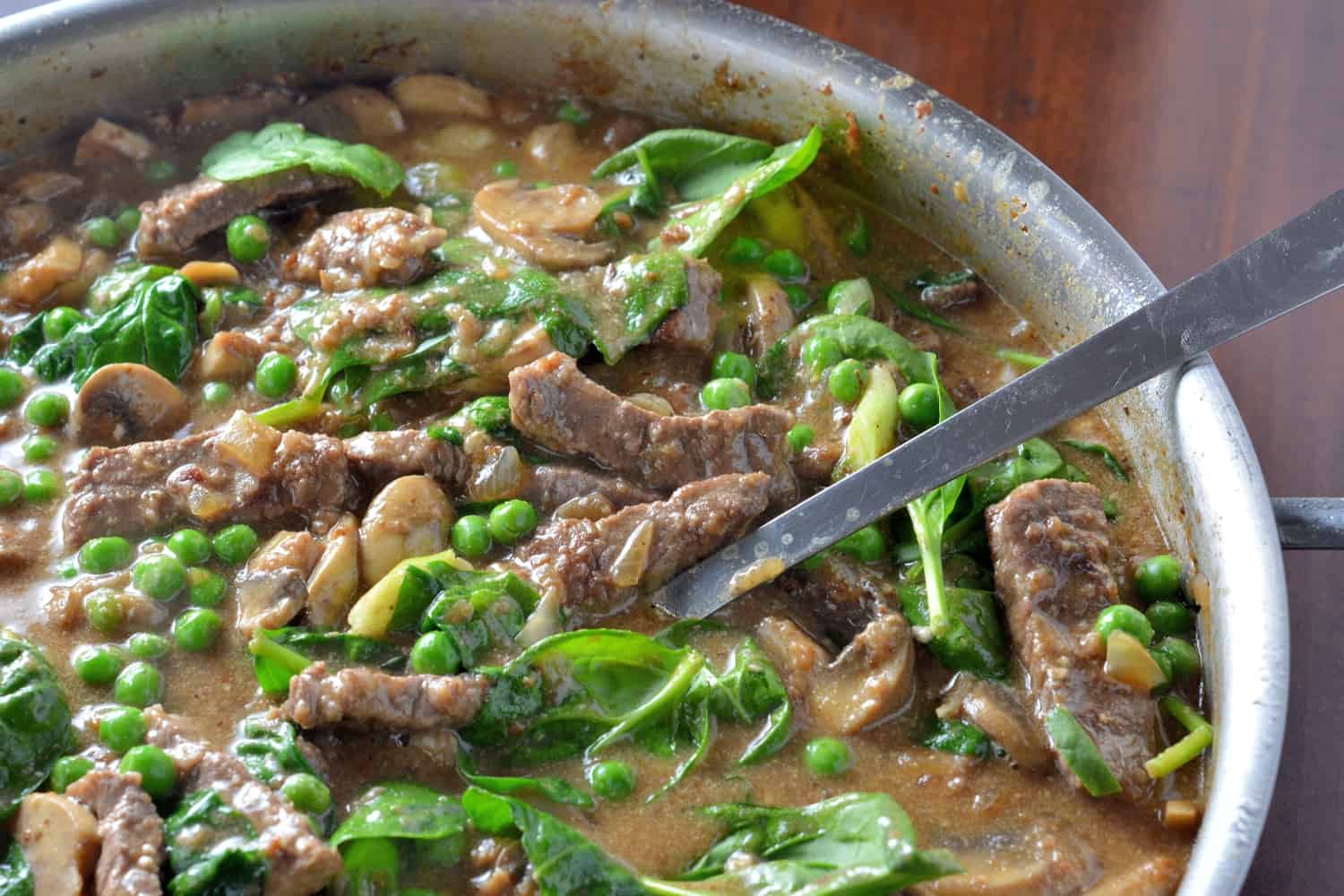 Skinny Beef Stroganoff Recipe- Fast, easy to make, beef stroganoff, that is family friendly and cuts down on calories by using yogurt instead of cream or sour cream. Added peas and spinach make this beef stroganoff THE BEST!