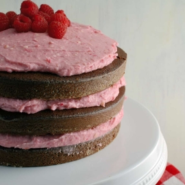 Chocolate Cake with Raspberry Buttercream- "naked cakes" are all the rage and so simple! Moist, rich, and delicious dark chocolate cake that's perfect for Valentine's Day!