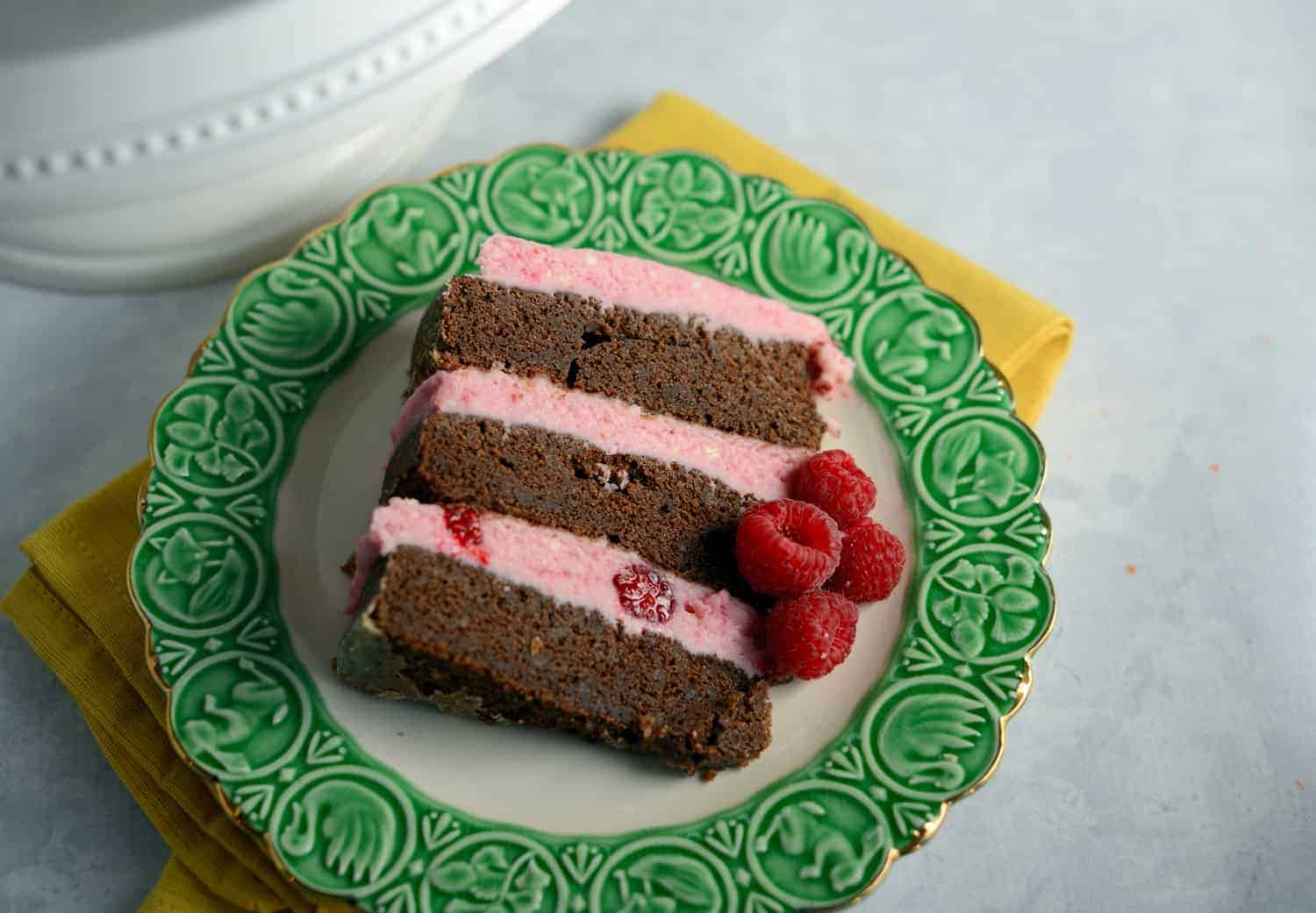 Chocolate Cake with Raspberry Buttercream- "naked cakes" are all the rage and so simple! Moist, rich, and delicious dark chocolate cake that's perfect for Valentine's Day!