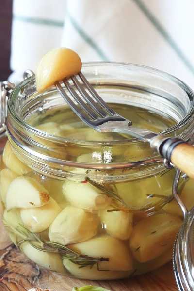glass jar of garlic confit