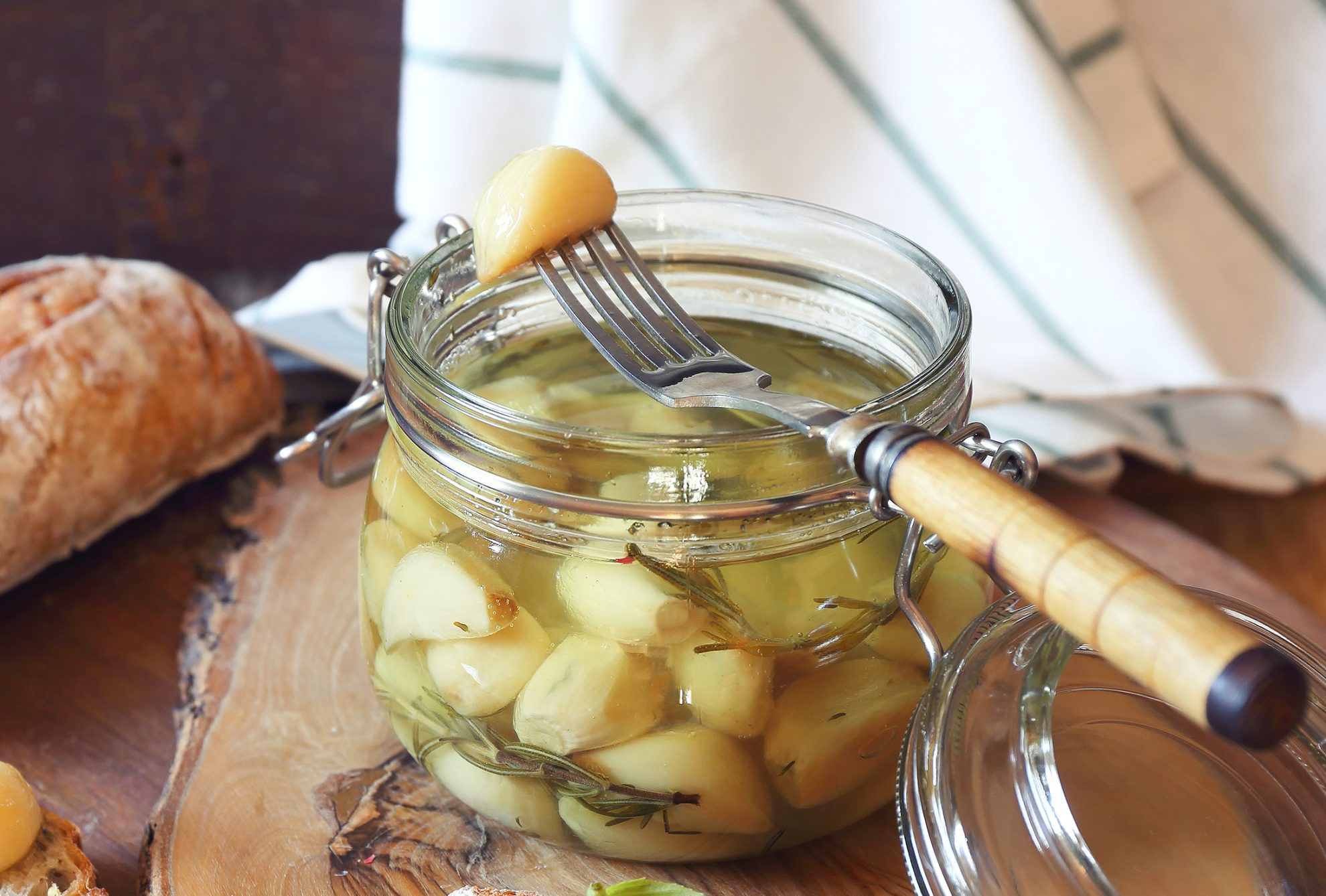 glass jar of garlic confit