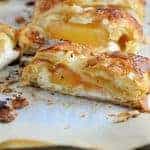 Easy Apple Cream Cheese Strudel Recipe- a twist of apple pie and apple crisp, this super simple dessert recipe uses cream cheese, puff pastry, almonds and apple pie filling in a lovely braid. www.savoryexperiments.com