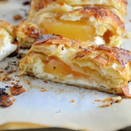 Easy Apple Cream Cheese Strudel Recipe- a twist of apple pie and apple crisp, this super simple dessert recipe uses cream cheese, puff pastry, almonds and apple pie filling in a lovely braid. www.savoryexperiments.com