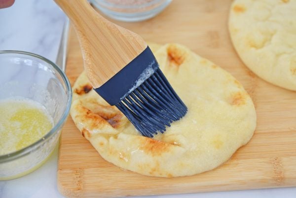 basting flatbread with melted butter