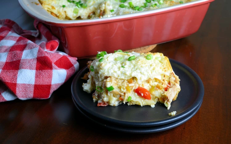 Green Chile Chicken Lasagna Recipe- it’s like a green chile enchilada chicken casserole and a lasagna recipe with ricotta smashed together. One of my best Hatch green chile recipes, it will soon be your favorite weeknight meal using pre-cooked chicken and no-bake lasagna noodles, it comes together in a snap! www.savoryexperiments.com