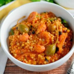 20 Minute Italian Seafood Stew Recipe- this seafood pasta is a classic Italian recipe made by fisherman’s wives using a variety of seafood making a small amount go a long way. Similar to cioppino, this recipe uses couscous for a satisfying and easy meal. www.savoryexperiments.com