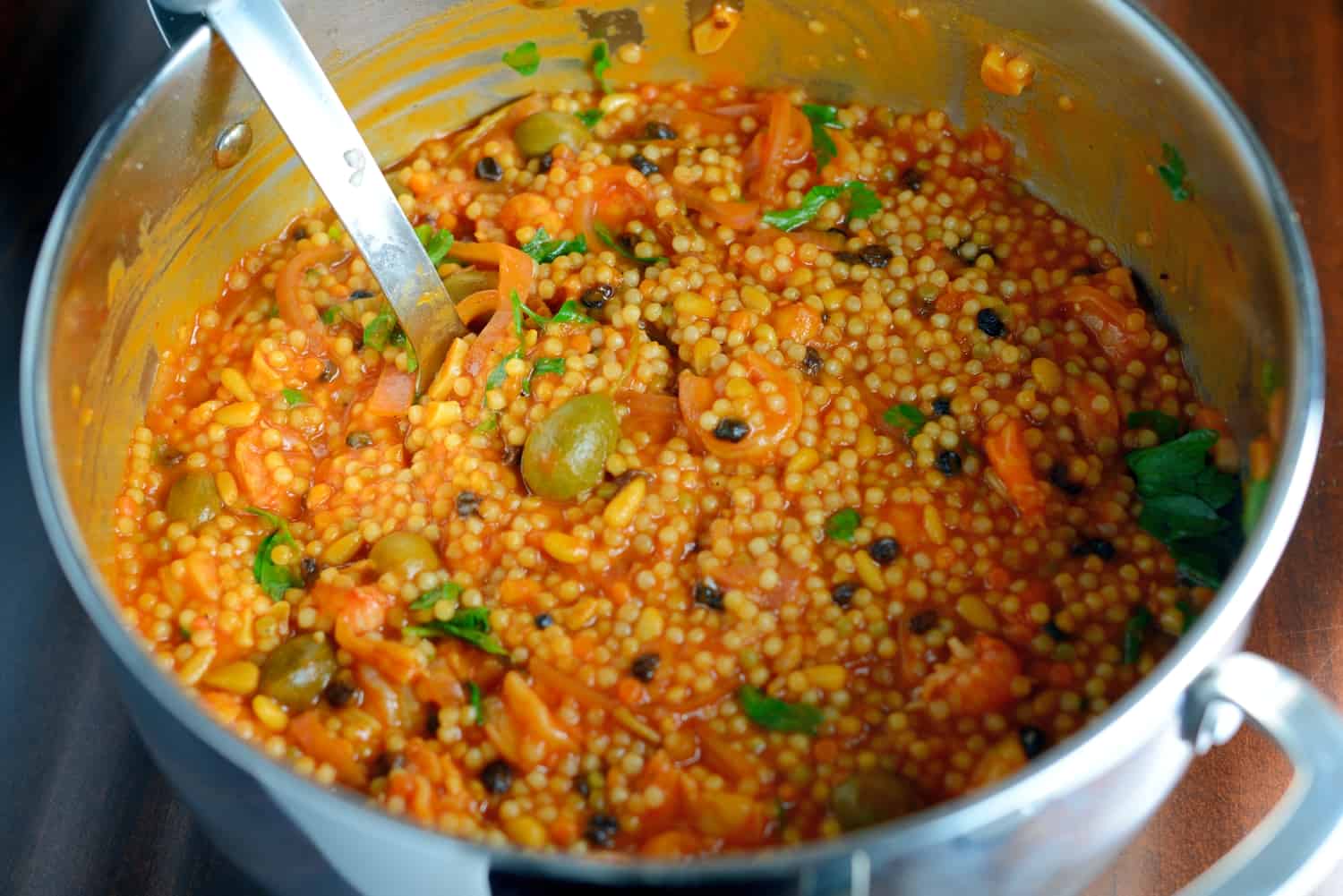 20 Minute Italian Seafood Stew Recipe- this seafood pasta is a classic Italian recipe made by fisherman’s wives using a variety of seafood making a small amount go a long way. Similar to cioppino, this recipe uses couscous for a satisfying and easy meal. www.savoryexperiments.com 