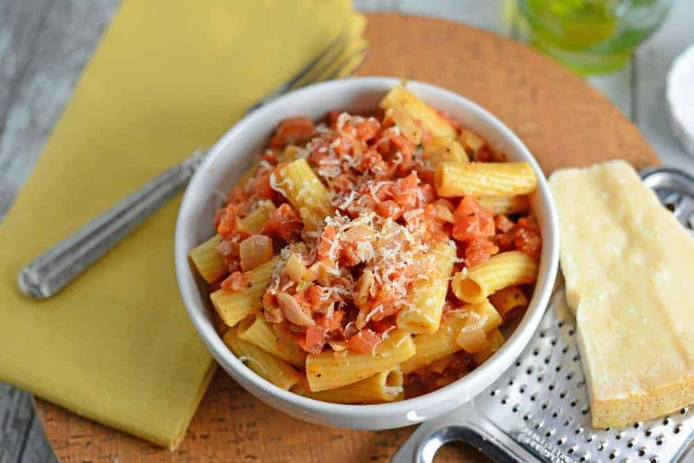 Creamy Vodka Sauce is an easy pasta sauce recipe pancetta, tomatoes and cream. Serve over your favorite pasta like Penne alla Vodka! #vokdasauce #penneallavodka www.savoryexperiments.com