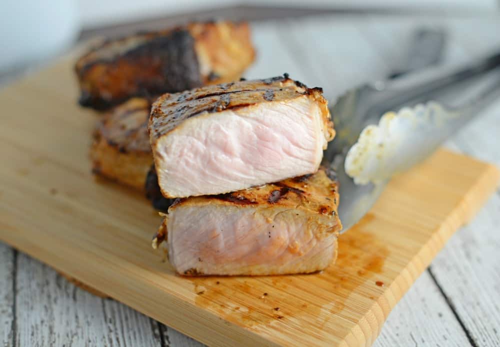 Dijon Pork Chops are a simple and zesty recipe that can be grilled, baked or pan fried. A family favorite grill recipe! www.savoryexperiments.com