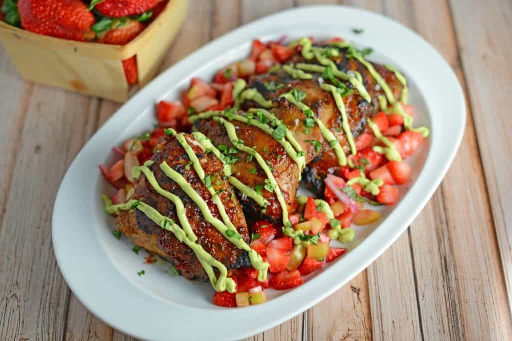 Strawberry BBQ Chicken Recipe- If you like strawberries, you are going to LOVE my strawberry BBQ Sauce recipe. Spread this BBQ sauce over chicken or seafood and serve with Strawberry Salsa on the side. A great and easy grilling idea and perfect for parties and potlucks!