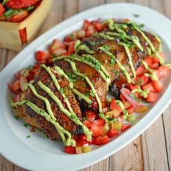 Strawberry BBQ Chicken Recipe- If you like strawberries, you are going to LOVE my strawberry BBQ Sauce recipe. Spread this BBQ sauce over chicken or seafood and serve with Strawberry Salsa on the side. A great and easy grilling idea and perfect for parties and potlucks!