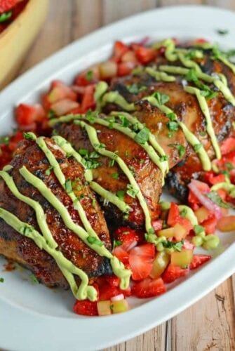 Strawberry BBQ Chicken Recipe- If you like strawberries, you are going to LOVE my strawberry BBQ Sauce recipe. Spread this BBQ sauce over chicken or seafood and serve with Strawberry Salsa on the side. A great and easy grilling idea and perfect for parties and potlucks!