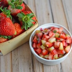 Strawberry Salsa Recipe- only 6 ingredients for this zingy and sweet strawberry salsa! Serve with cinnamon and sugar pita chips, on ice cream, on top of a salad or with grilled salmon, chicken or shrimp.