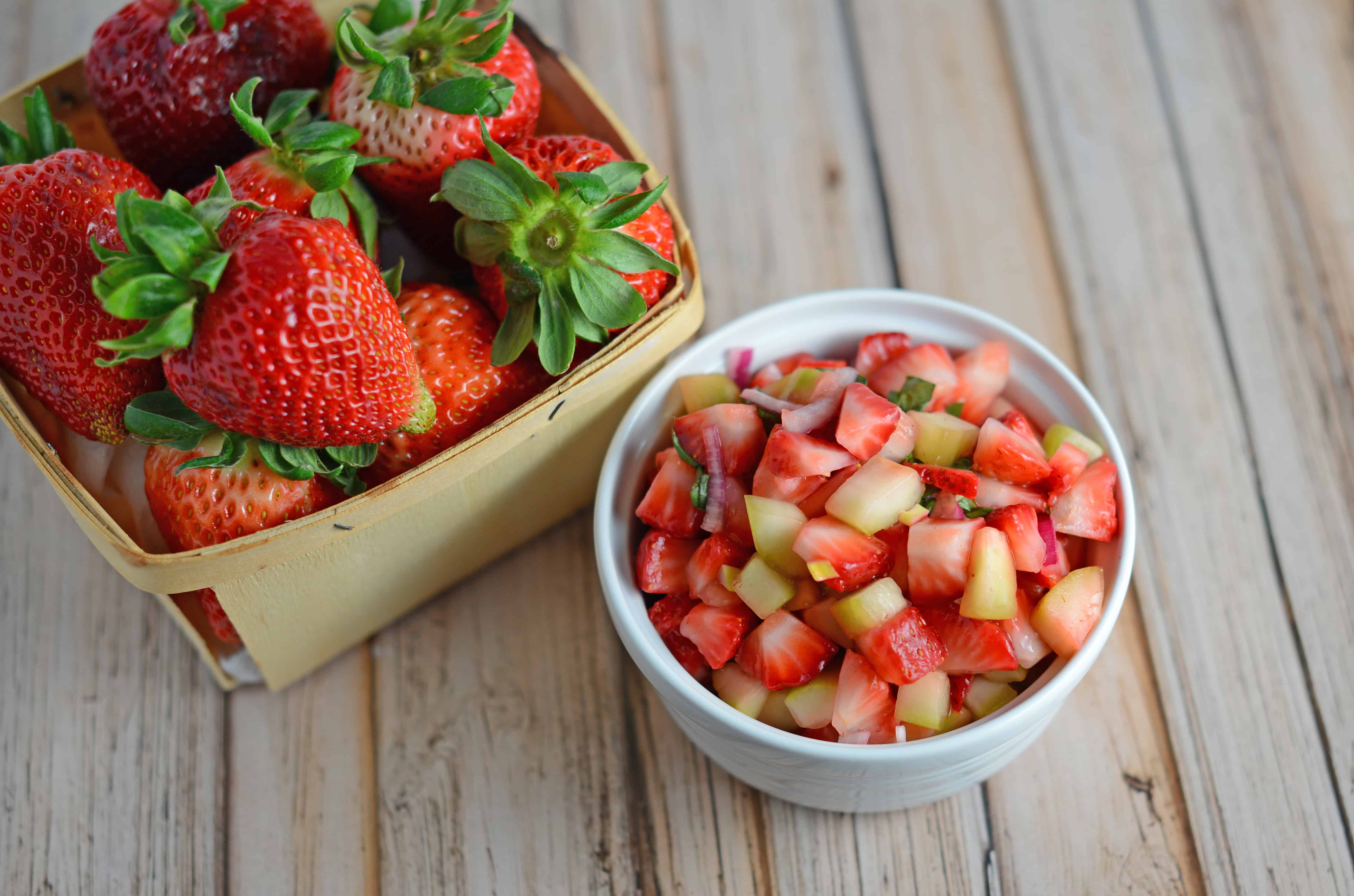 Strawberry Salsa Recipe- only 6 ingredients for this zingy and sweet strawberry salsa! Serve with cinnamon and sugar pita chips, on ice cream, on top of a salad or with grilled salmon, chicken or shrimp. www.savoryexperiments.com