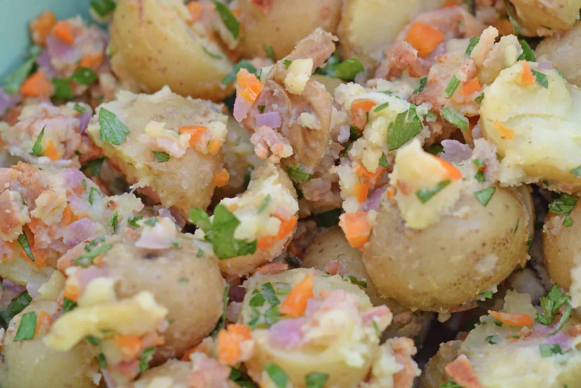 Bacon Potato Salad can be served hot or cold and uses veggies and BACON! This is a NO MAYO potato salad! The perfect make ahead side dish. #potatosalad #nomayopotatosalad www.savoryexperiments.com