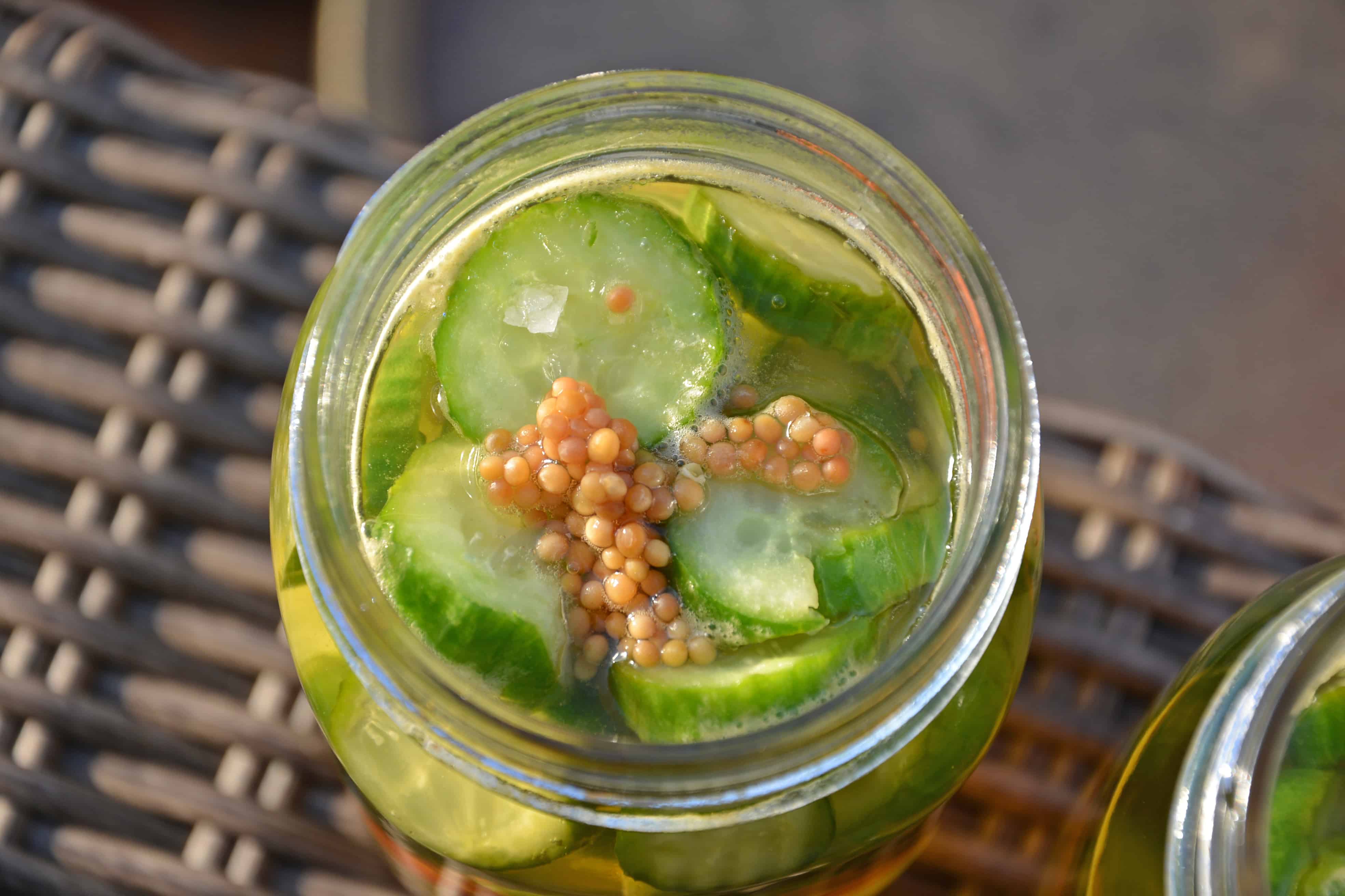 Honey Habanero Pickles - It only takes a few minutes to make Easy Refrigerator Honey Habanero Pickles. Once you make your own homemade version, you'll never buy store bought again- these are spicy and sweet and are ready in just 1 week! www.savoryexperiments.com