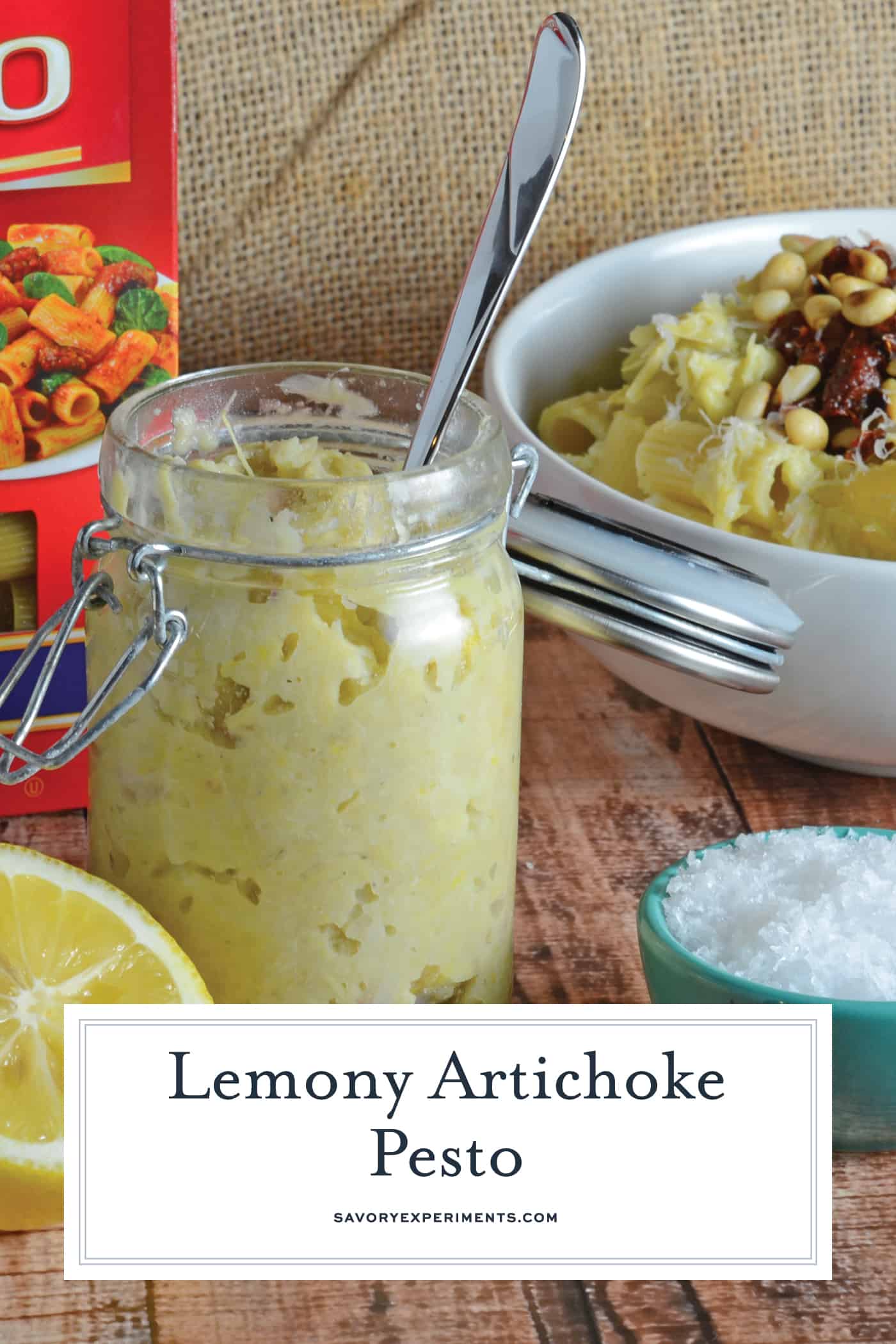 Lemony Artichoke Pesto is a fresh and punchy sauce perfect for summer meals and pasta. Takes only minutes to make, stores and freezes well and makes an excellent gift. Top with pine nuts, sun dried tomatoes and Parmesan Reggiano cheese. #homemadepestosauce #artichokes www.savoryexperiments.com