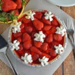 No-Bake Strawberry Cream Cheese Pie- A no-bake pie made with graham cracker crust, a layer of sweet cream cheese, loads of fresh strawberries and a homemade strawberry jelly. All ready in less than 20 minutes! www.savoryexperiments.com