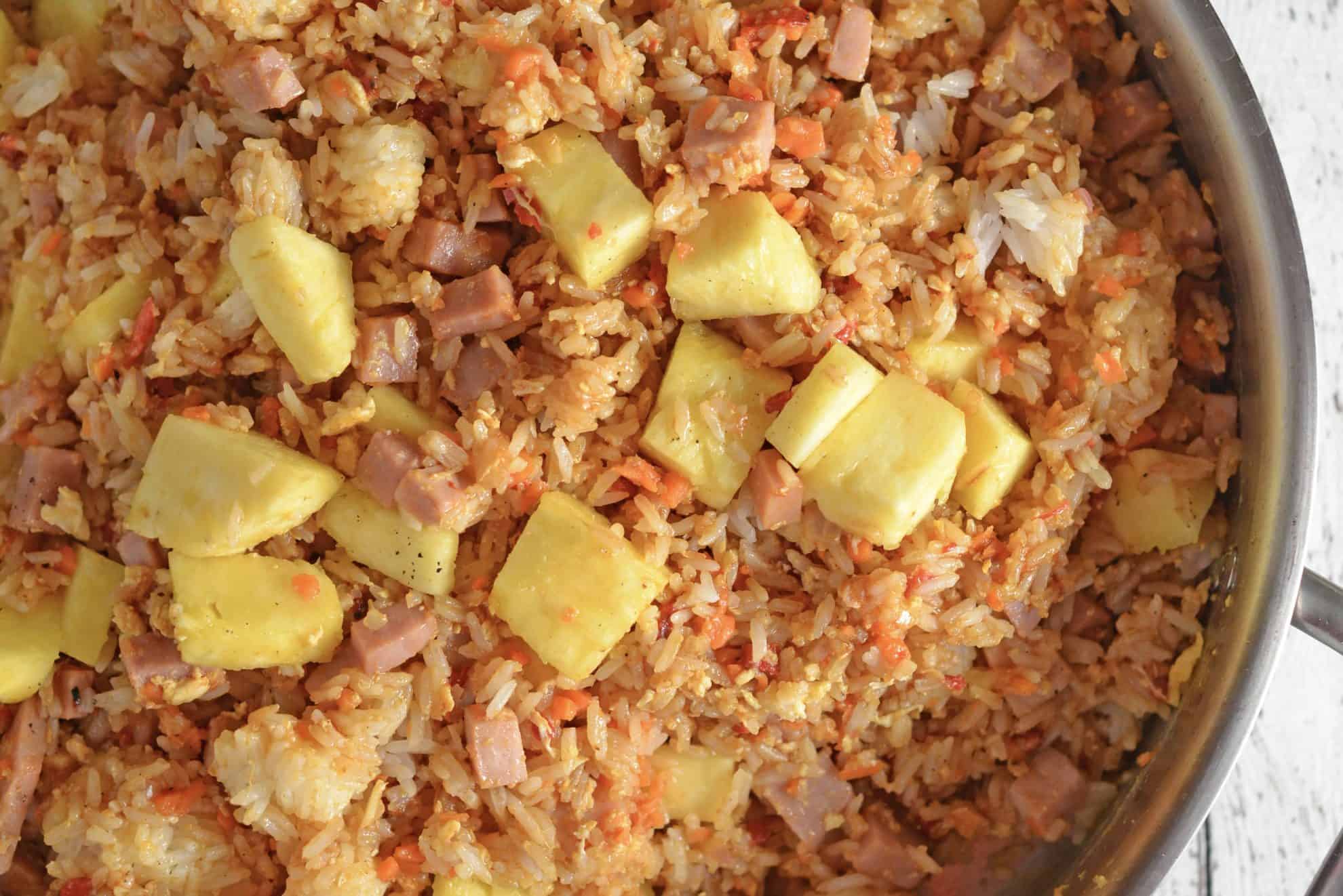 close up of ham and pineapple fried rice in a skillet 