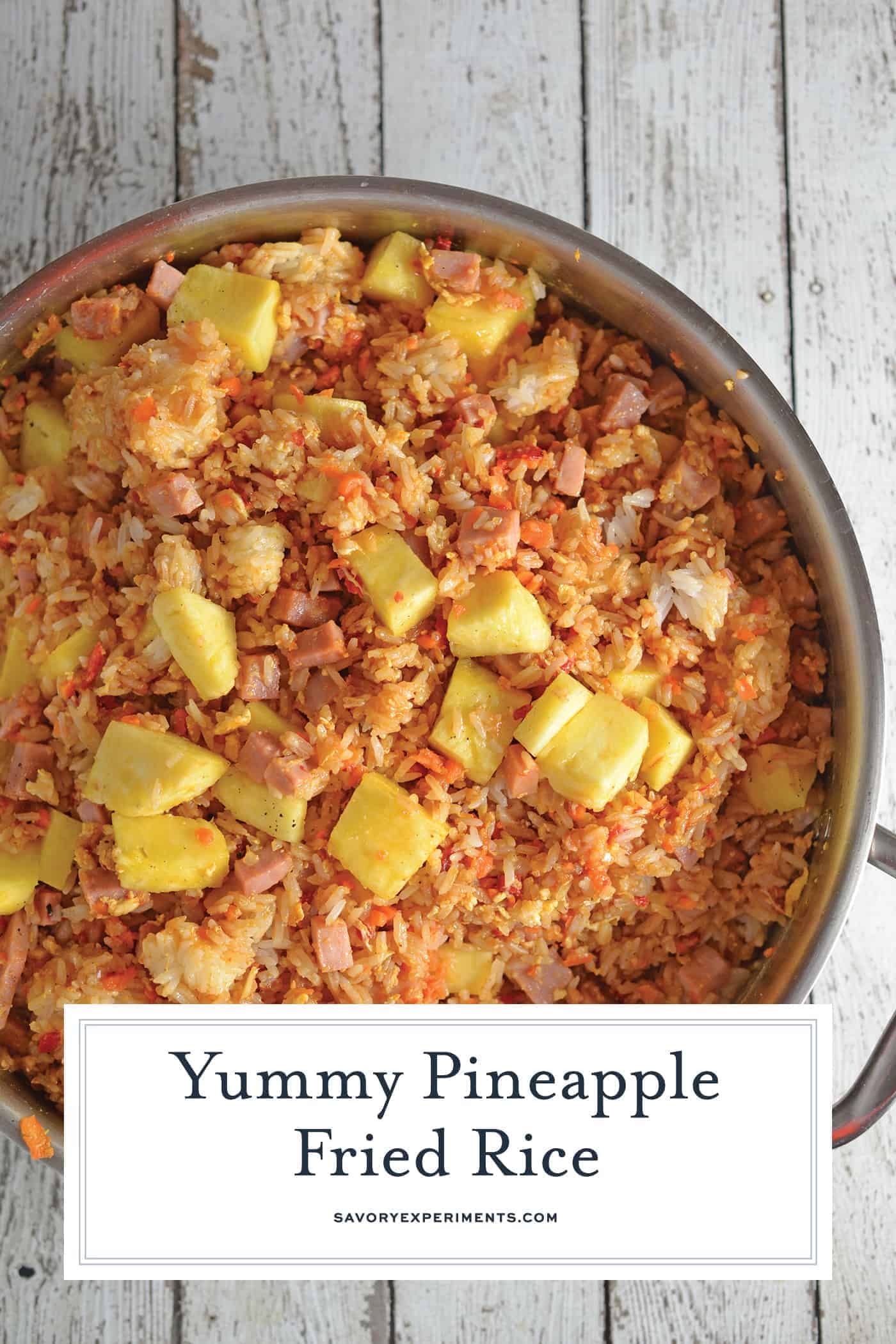 Pineapple Fried Rice is a quick, easy weeknight meal that's much cheaper, tastier and healthier than take-out! Make it a vegetarian meal or add ham. #pineapplefriedrice #easyfriedricerecipe www.savoryexperiments.com