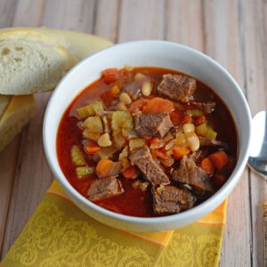 Short Rib Soup Recipe- a hearty comforting soup made with vegetables and shredded short ribs. Also known as Booyah in parts of the US. This soup can be served as an appetizers or entree and freezes well.