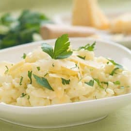 bowl of risotto with parsley and cheese