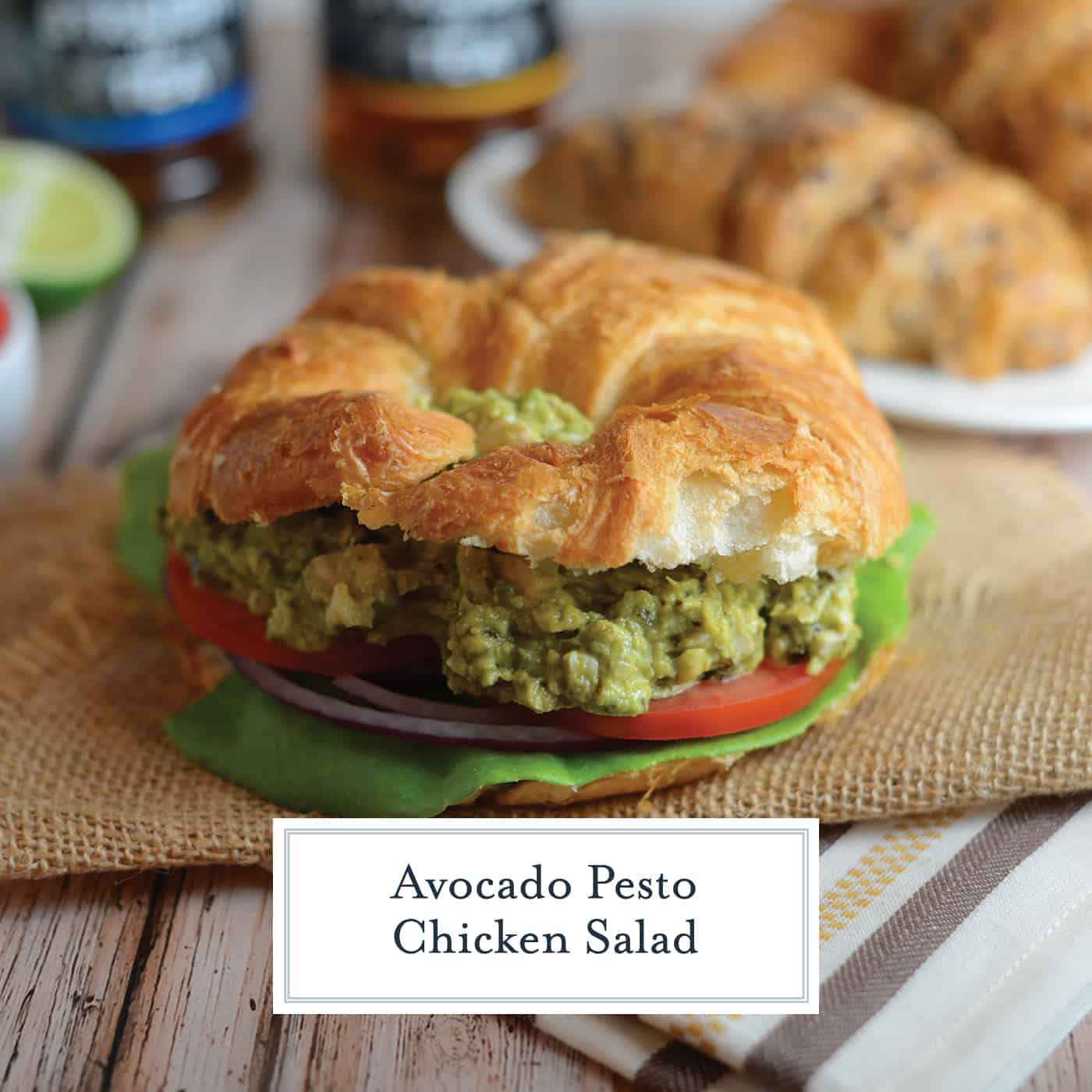 Pesto Avocado Chicken Salad swaps out the heavy mayonnaise for creamy avocado. Pesto adds flavor and lime juice brightens shredded chicken from precooked rotisserie chicken. #healthychickensalad #avocadochickensalad #easychickensalad www.savoryexperiments.com