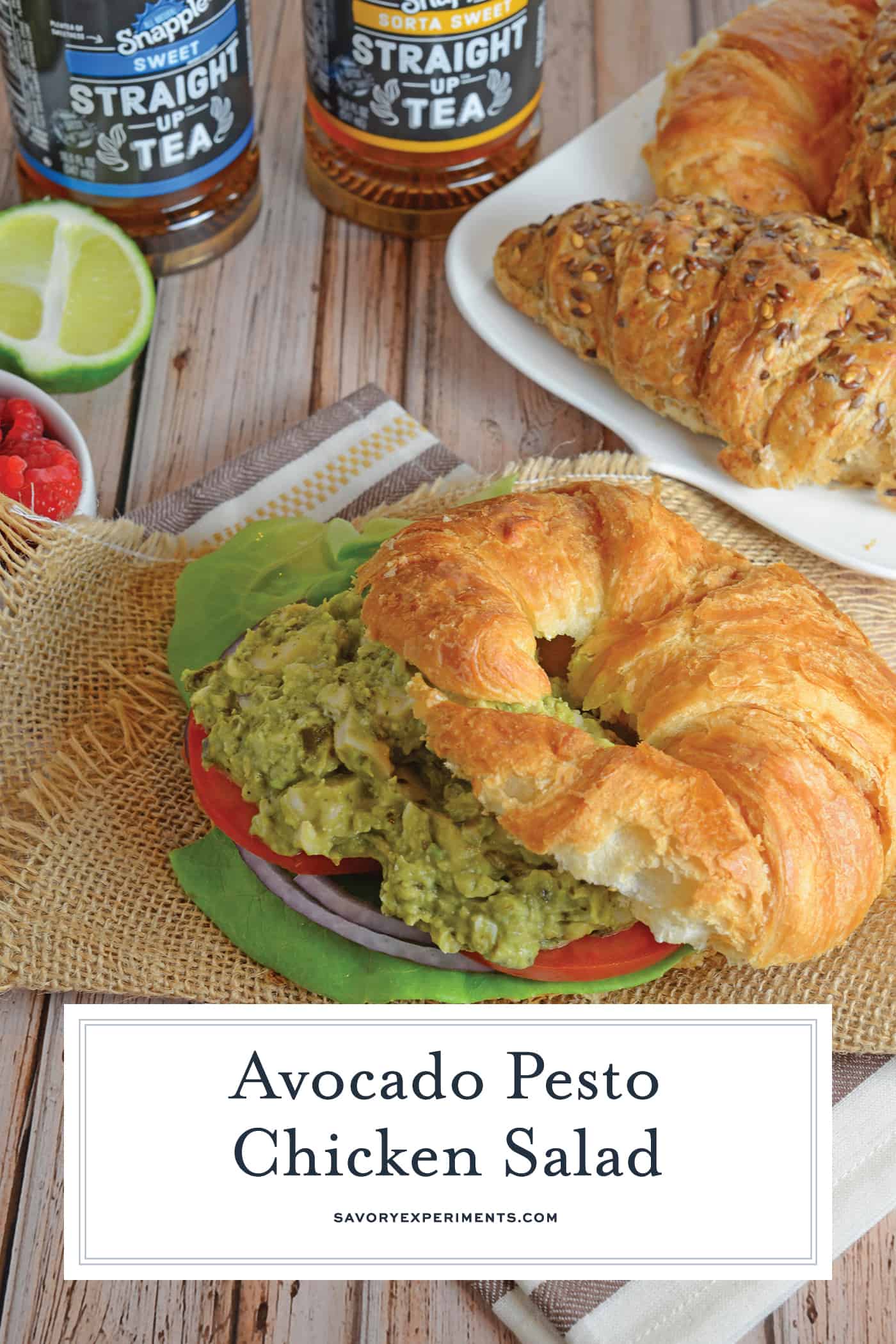 Pesto Avocado Chicken Salad swaps out the heavy mayonnaise for creamy avocado. Pesto adds flavor and lime juice brightens shredded chicken from precooked rotisserie chicken. #healthychickensalad #avocadochickensalad #easychickensalad www.savoryexperiments.com